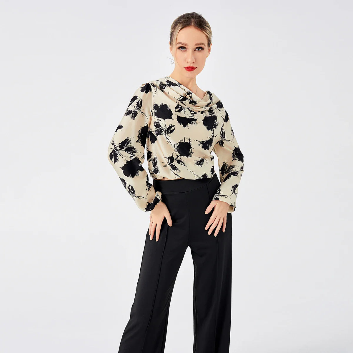 Elegant ladies' blouse with a printed pattern, dropped collar, and long sleeves in a classic white colour
