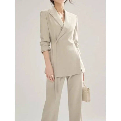 Elegant vintage-inspired two-piece office suit with tailored blazer and high-waisted trousers in premium polyester fabric