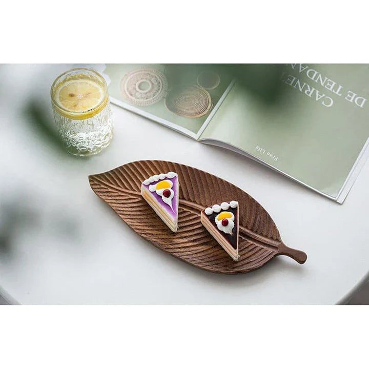 Elegant leaf-shaped serving platter made of solid oak wood, featuring a natural and stylish design for hosting and entertaining