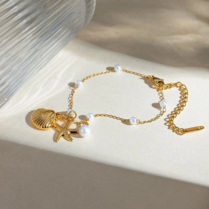 Elegant 18K gold-plated bracelet with a pearl starfish pendant on a snake bone chain
