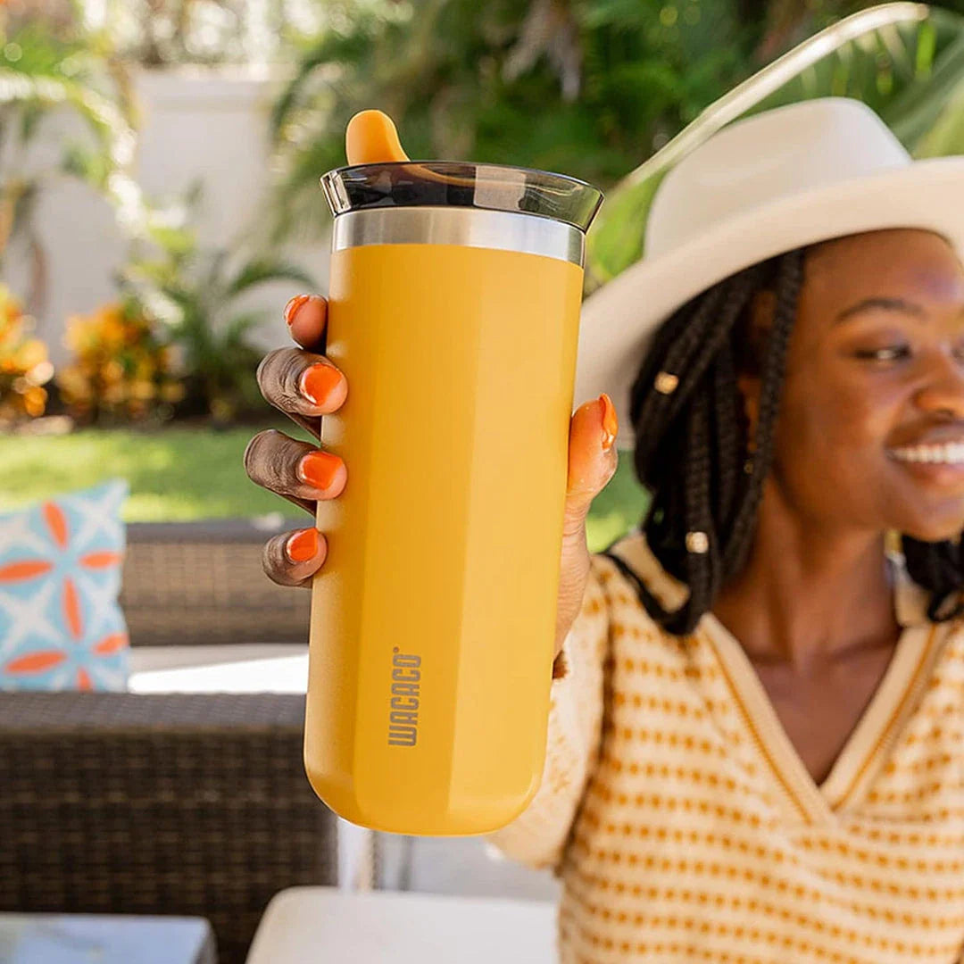 Premium insulated stainless steel travel mug in various vibrant colours, designed for keeping hot and cold drinks at the perfect temperature for on-the-go British lifestyles.