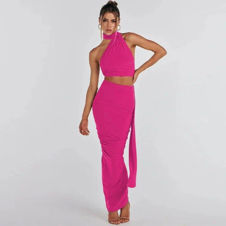 Elegant backless cocktail dress set with halter crop top and maxi skirt, perfect for summer events and occasions
