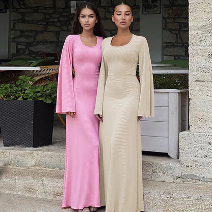 Elegant U-neck dress with lace-up back and flowing bell sleeves in a variety of sophisticated colours