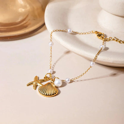 Elegant 18K gold-plated bracelet with a pearl starfish pendant on a snake bone chain