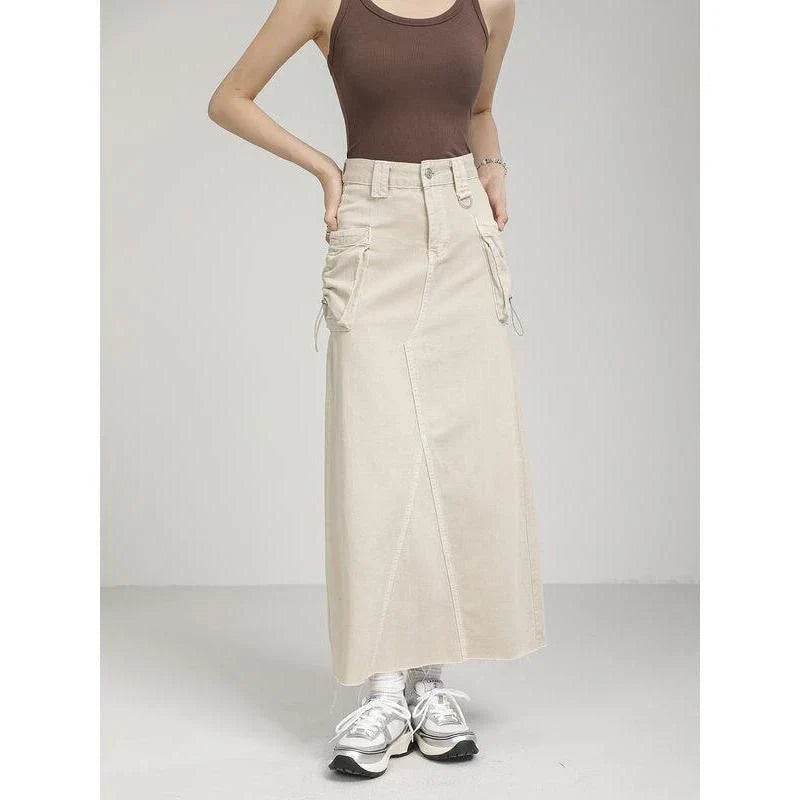 Elegant autumn vintage high-waist denim cargo skirt with pockets, featuring a flattering A-line silhouette and practical design