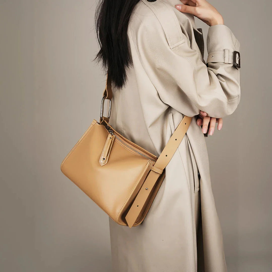 Genuine leather shoulder bag with soft, pillow-like shape and secure zipper closure