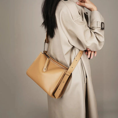 Genuine leather shoulder bag with soft, pillow-like shape and secure zipper closure