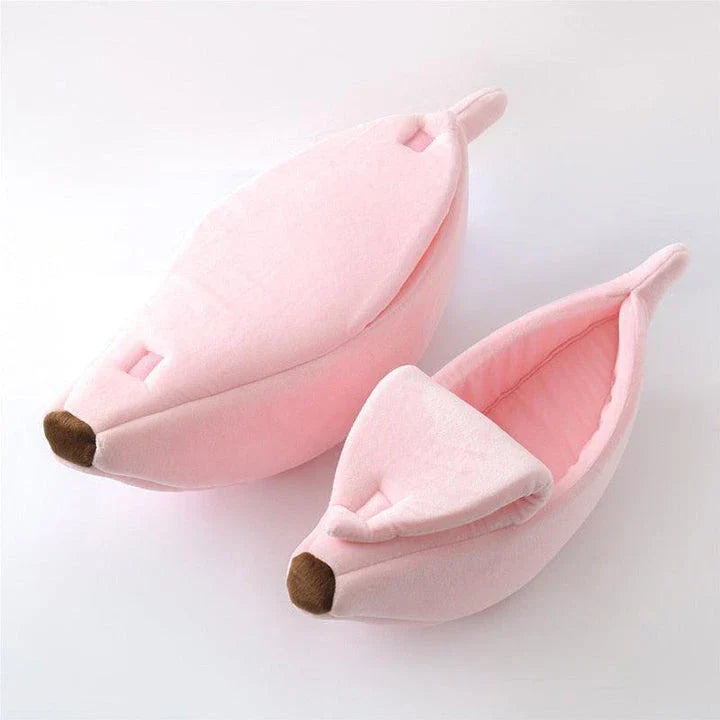 A cosy, banana-shaped cat bed made of plush, supportive materials in various vibrant colours to provide a comfortable and stylish retreat for feline friends.