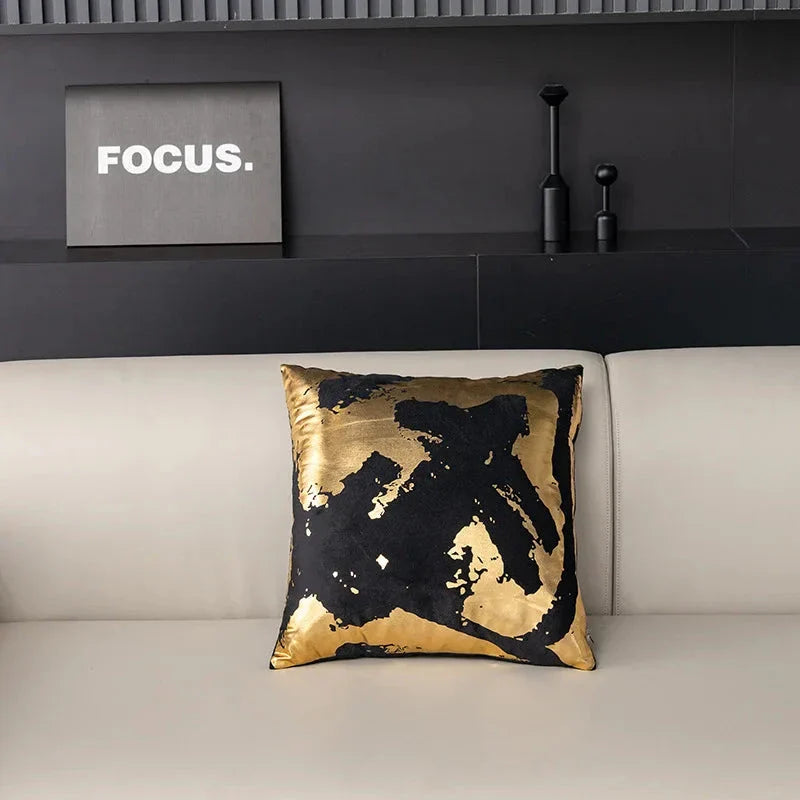 Pair of Nordic-inspired geometric plush pillowcases with a luxurious gold pattern on a white and black background