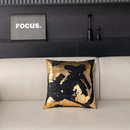Pair of Nordic-inspired geometric plush pillowcases with a luxurious gold pattern on a white and black background