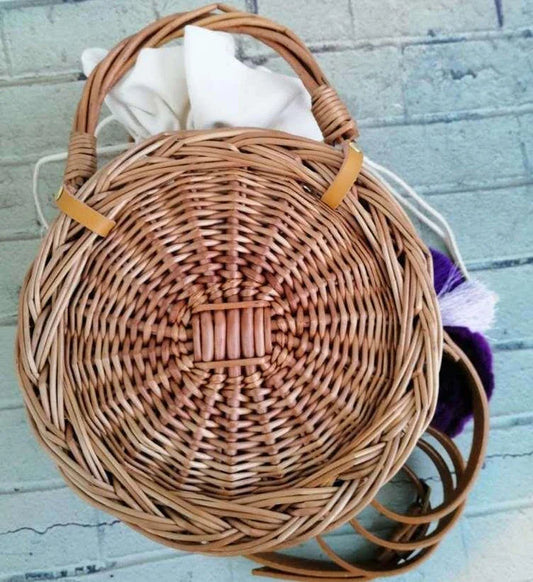 Charming floral hanging basket made of premium rattan, featuring a delicate flower pattern and versatile design for indoor or outdoor use.