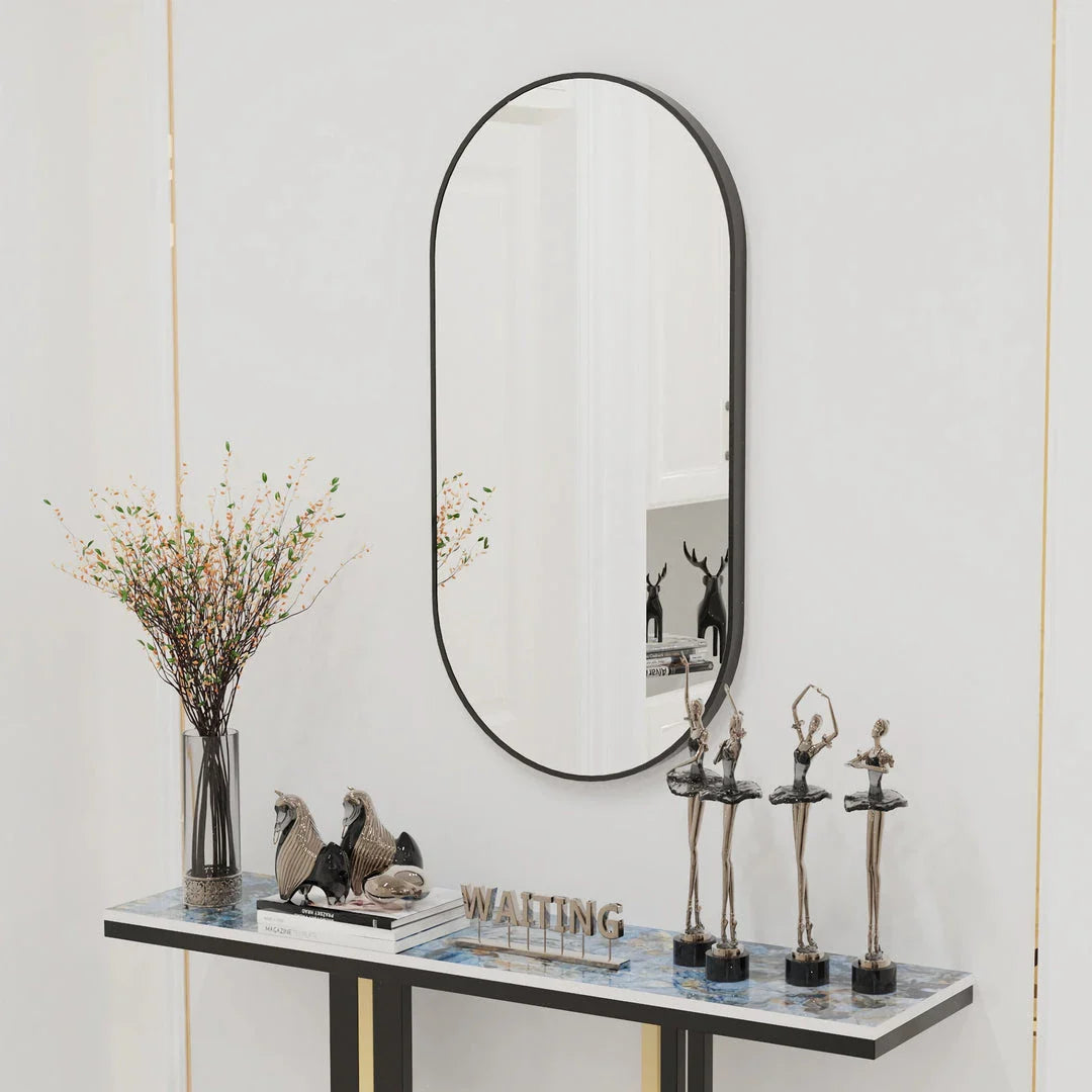 Elegant black oval-shaped wall mirror with a modern and sophisticated design, perfect for bathroom, entryway, and living room decor.