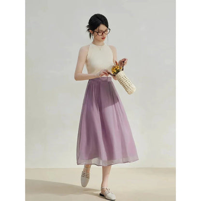 Elegant high-waist a-line midi skirt in a solid, vibrant colour for professional and social wear