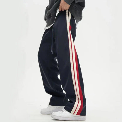 Chic wide-leg trousers in black and dark blue, featuring a draping silhouette and mid-waist design for a sophisticated look.