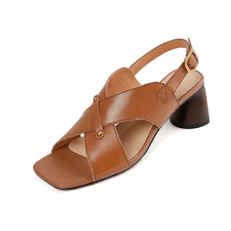 Elegant leather high heel sandals in khaki colour for women, featuring a 5.5 cm square heel, secure buckle strap, and sleek design.