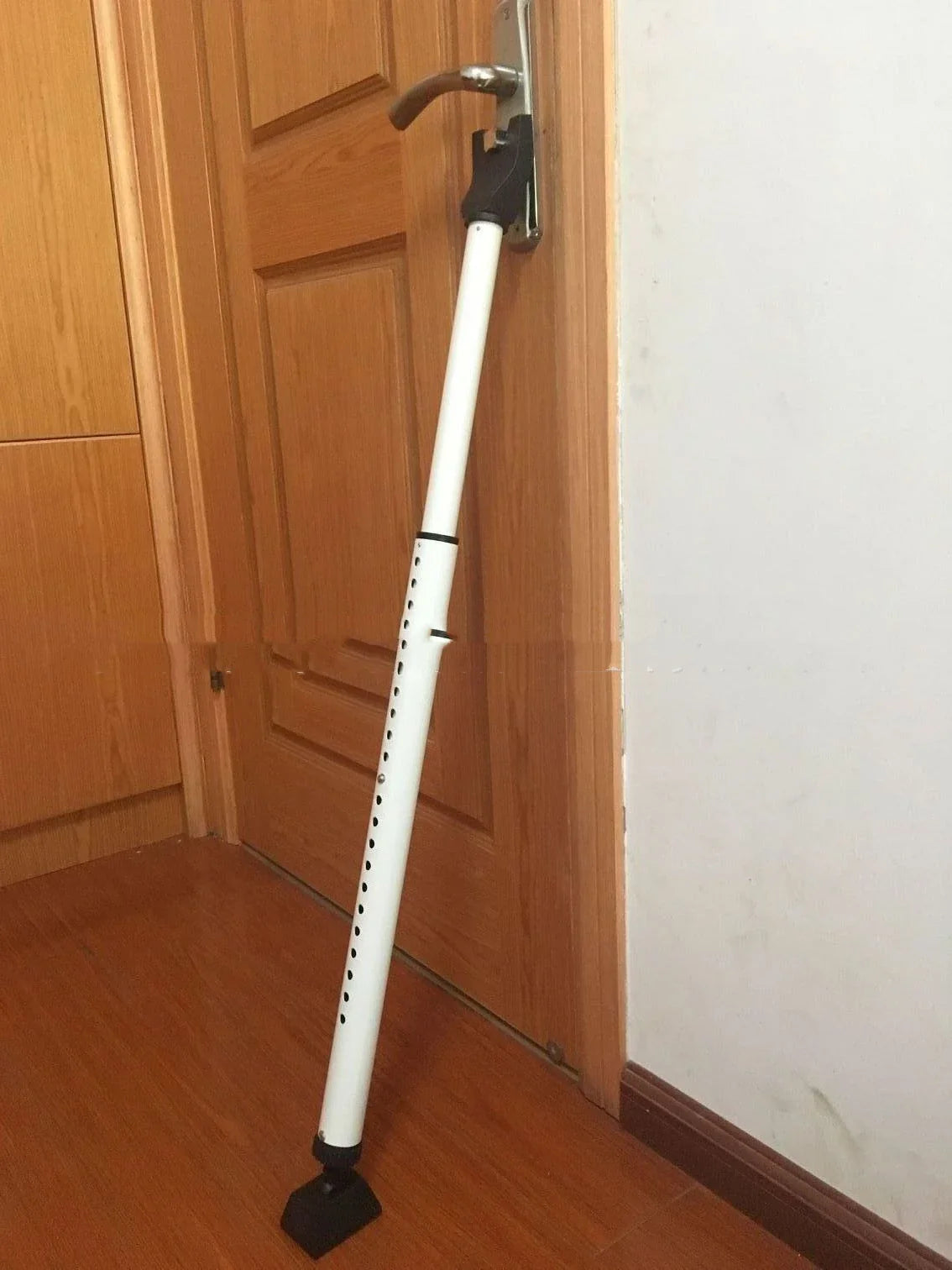 Adjustable anti-theft door security gate made of durable steel with a contemporary design to enhance home security and aesthetics.