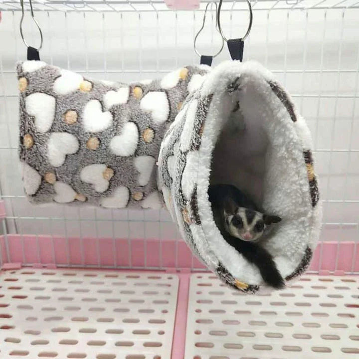 Cosy plush tunnel in grey for small pets like hamsters and guinea pigs, providing a comfortable and secure hideaway