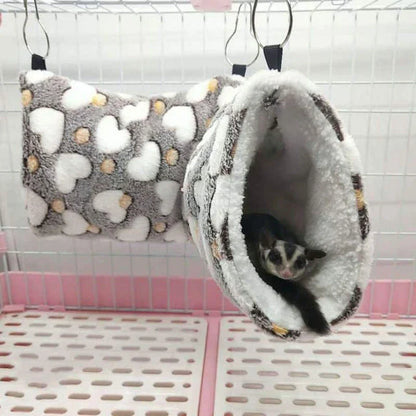 Cosy plush tunnel in grey for small pets like hamsters and guinea pigs, providing a comfortable and secure hideaway