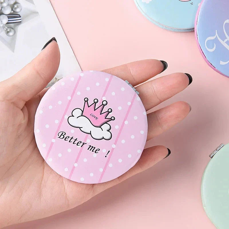 Compact portable foldable makeup mirror with cute cartoon prints for on-the-go beauty touch-ups