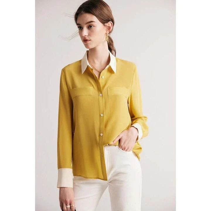 A chic and elegant silk crepe de chine blouse in a timeless solid pattern, perfect for professional and casual wear.