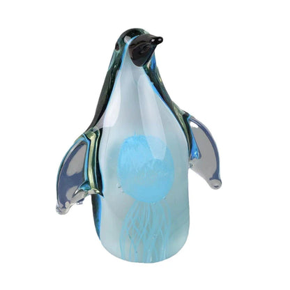 Exquisite handcrafted glass penguin ornament with a striking green-backed design, showcasing the beauty of marine life