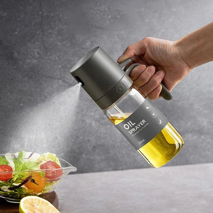 Elegant borosilicate glass oil spray bottle with ergonomic design for hassle-free, healthy cooking