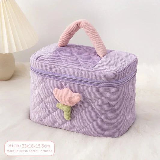 Elegant corduroy cosmetic bag with tulip flower design, available in pink, purple, blue, and white colours