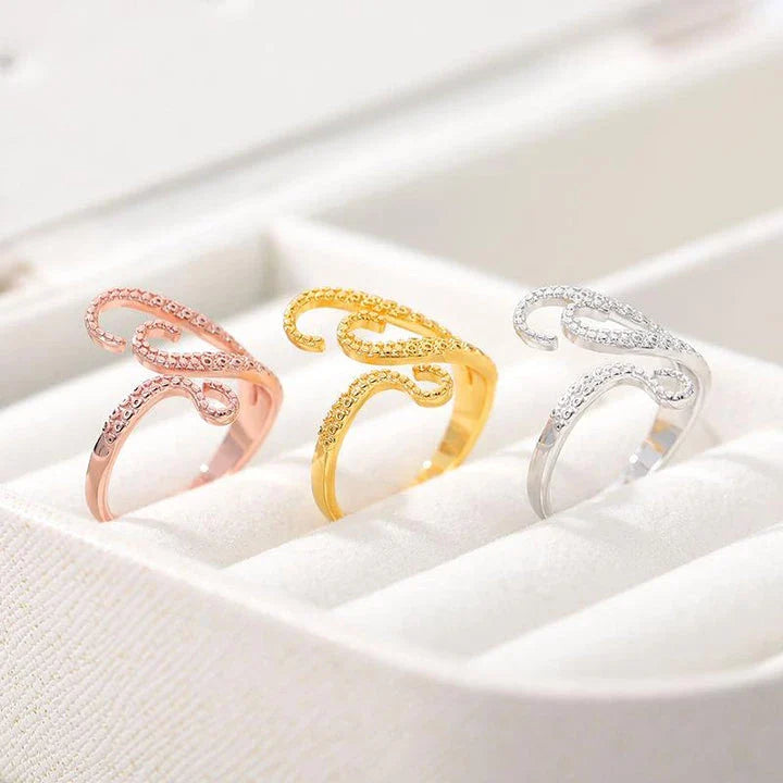Elegant adjustable wrap ring with a detailed octopus tentacle design, made from durable stainless steel.