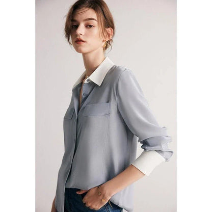A chic and elegant silk crepe de chine blouse in a timeless solid pattern, perfect for professional and casual wear.