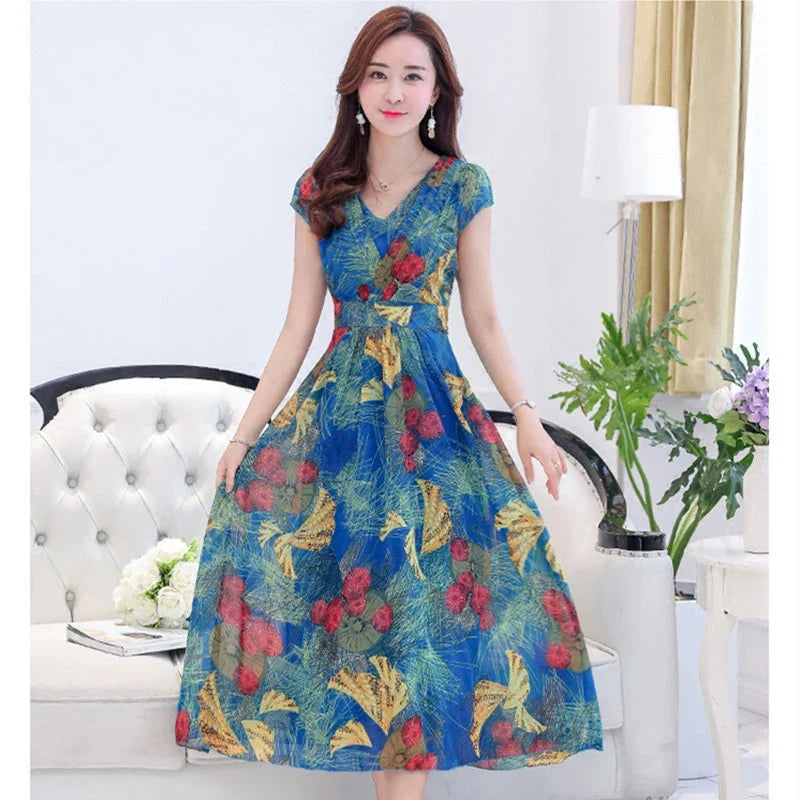 A graceful chiffon dress with short sleeves and a floor-sweeping hem, featuring a delicate printed pattern for a sophisticated, elegant look.
