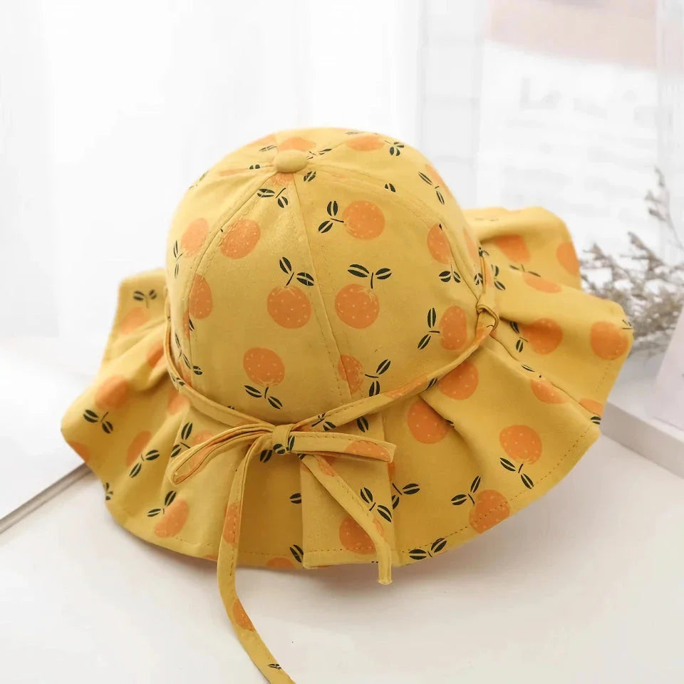 Adjustable cotton sun protection bucket hats for children with whimsical cartoon designs