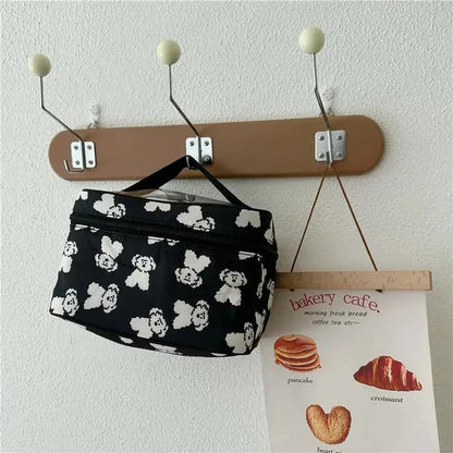 Cute dog-themed makeup bag with a playful design, made from durable cotton and PVC materials for practical and stylish organisation.