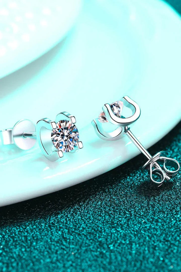Pair of elegant 1 carat moissanite stud earrings in a minimalist silver setting, perfect for everyday wear or special occasions.
