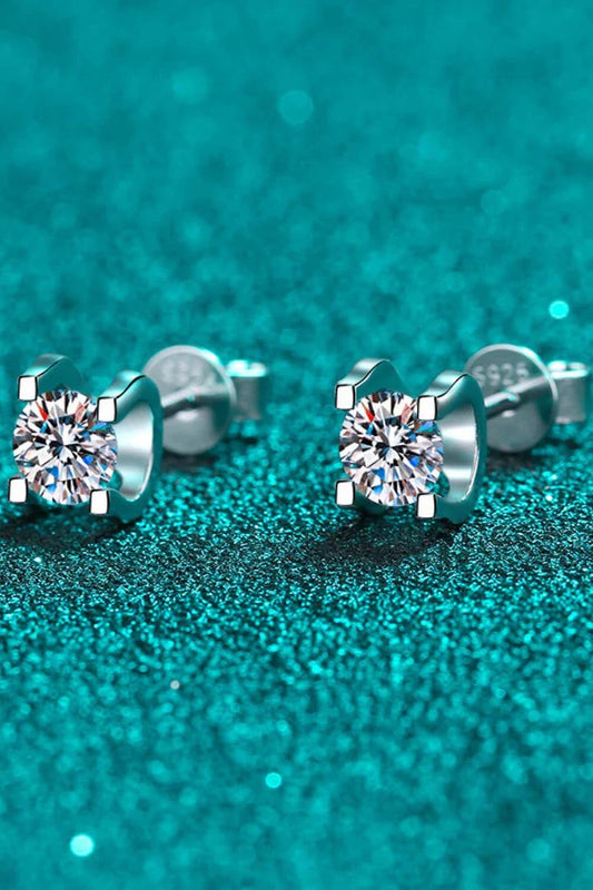 Pair of elegant 1 carat moissanite stud earrings in a minimalist silver setting, perfect for everyday wear or special occasions.