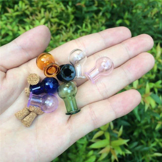 Multicoloured mini glass bottles in a charming ball shape, perfect for home or office decor