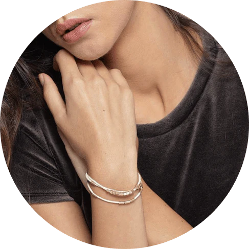 Elegant layered bracelet with beige leather and gold-coloured beads, a versatile accessory for modern British style