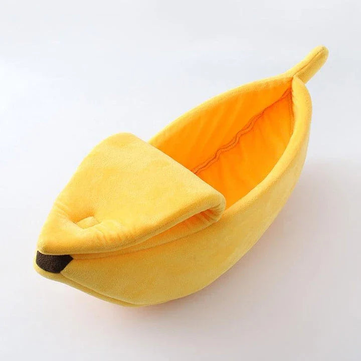 A cosy, banana-shaped cat bed made of plush, supportive materials in various vibrant colours to provide a comfortable and stylish retreat for feline friends.