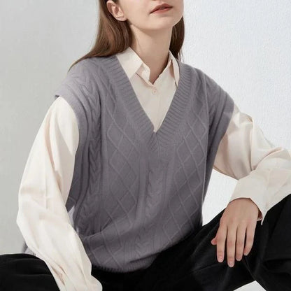 Cosy oversized knitted vest in various colours, featuring a sleeveless V-neck design for versatile layering