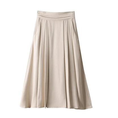 Elegant high-waisted pleated skirt with pockets in apricot colour, made from a blend of acrylic, cotton, and polyester for comfort and durability.