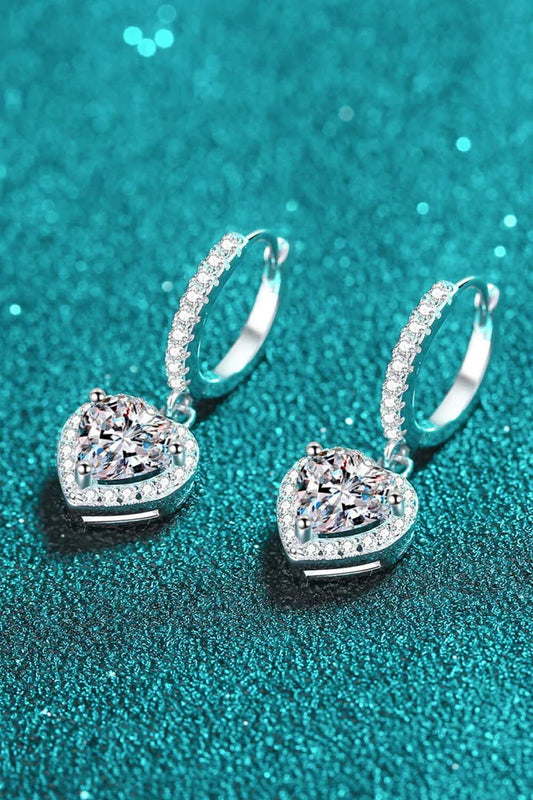 A pair of elegant moissanite heart-shaped drop earrings with a brilliant 2-carat display, crafted in 925 sterling silver with rhodium plating and zircon accents.