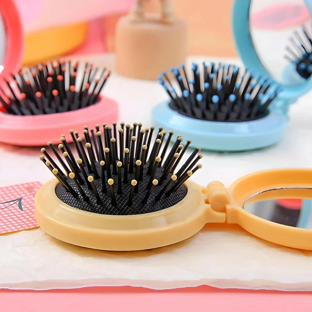 Portable folding hair comb with mirror, featuring a dual-sided design with a round mirror and eco-friendly hairbrush for on-the-go styling and grooming