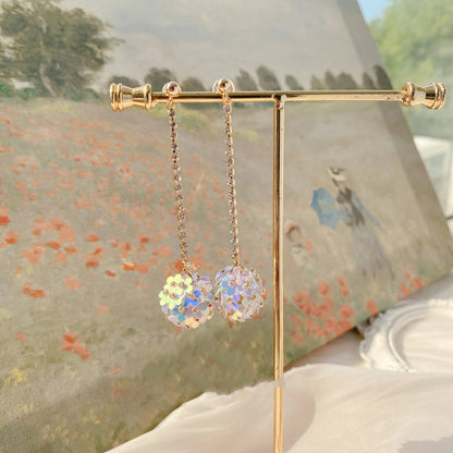 Elegant sterling silver floral drop earrings with delicate petal details, a timeless accessory for the modern British woman.