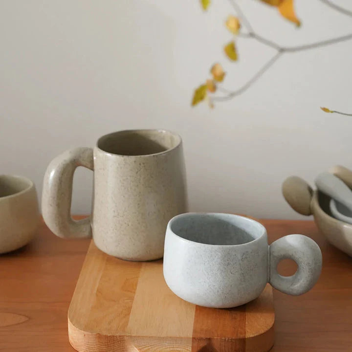 Elegant Japanese stoneware retro coffee mug in solid apricot and grey colours with comfortable handgrip shape