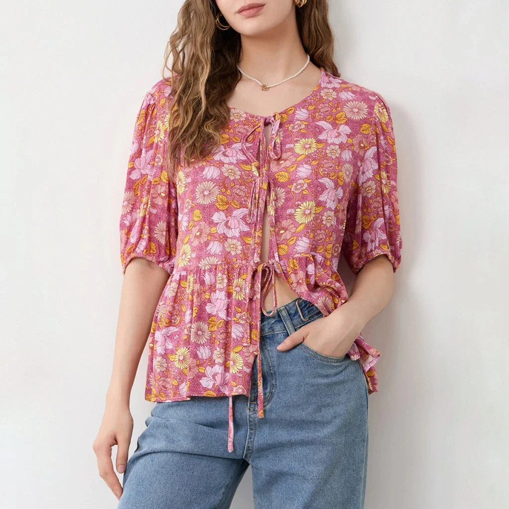 Elegant floral lace-up bow blouse with unique hollow-out details and a delicate floral print