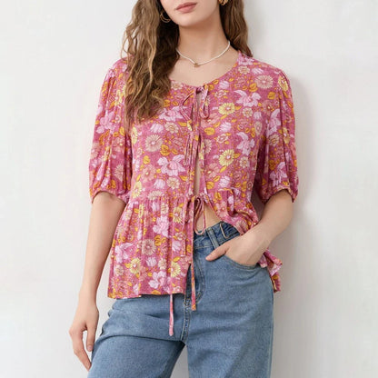 Elegant floral lace-up bow blouse with unique hollow-out details and a delicate floral print