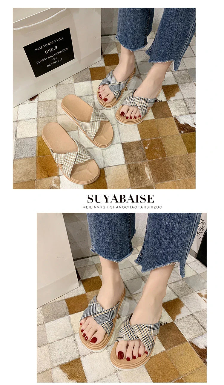 Comfortable and stylish herringbone slippers with a charming bow detail, perfect for indoor and light outdoor use.