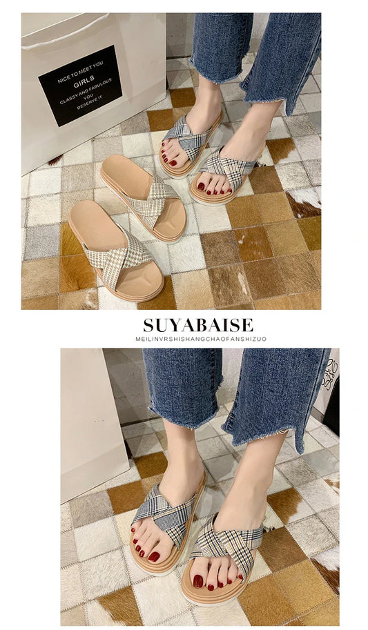 Comfortable and stylish herringbone slippers with a charming bow detail, perfect for indoor and light outdoor use.