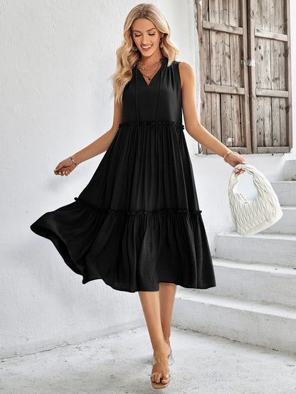 Elegant V-neck sleeveless summer dress in loose fit, available in a range of vibrant colours including light orange, black, and blue.
