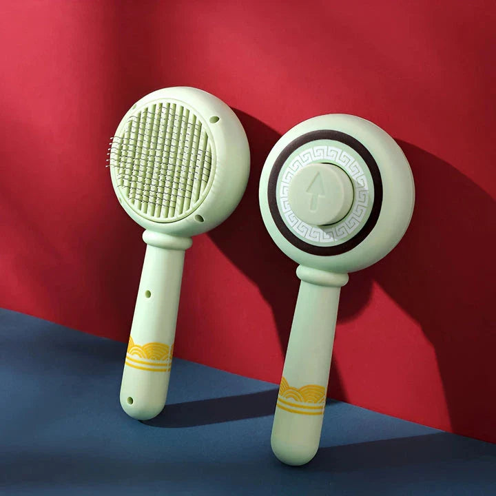 One-Click Pet Hair Removal Comb in red colour, designed to effectively remove loose fur and tangles from cat or dog coats