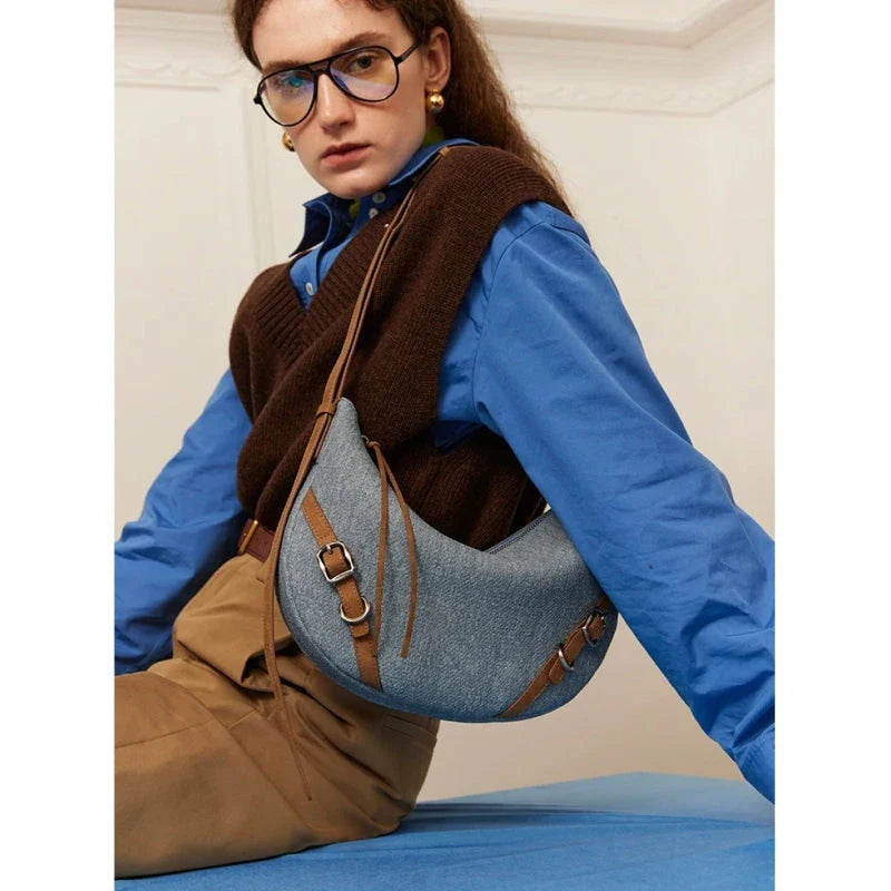 Elegant leather shoulder and crossbody bag for women, featuring a spacious main compartment, interior zip pocket, and contemporary design